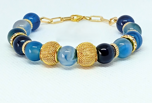 ARMBÅND BLUE SEA. Guld, rustfrit stål, naturlig blå agat sten. Kvinde. Håndlavede